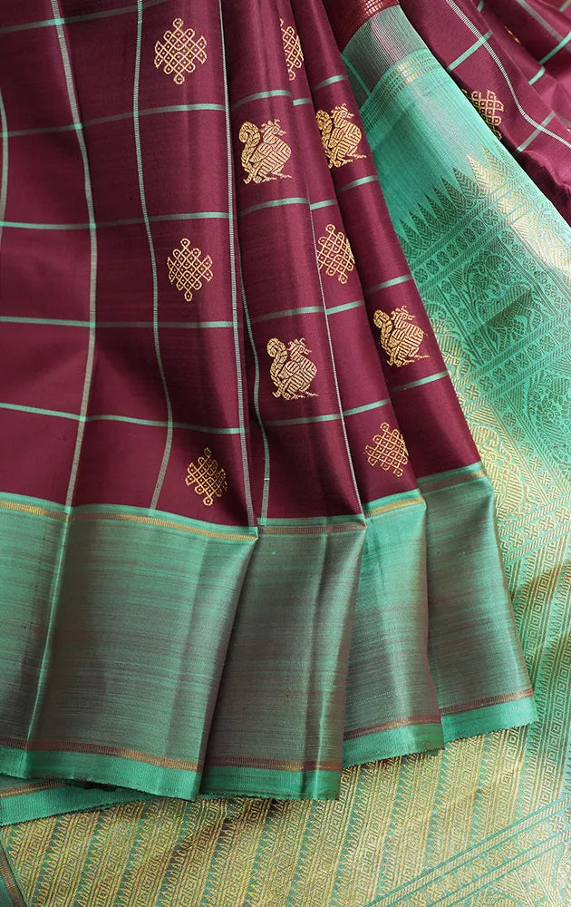 Brown zari checked kanchipuram silk saree with teal green border