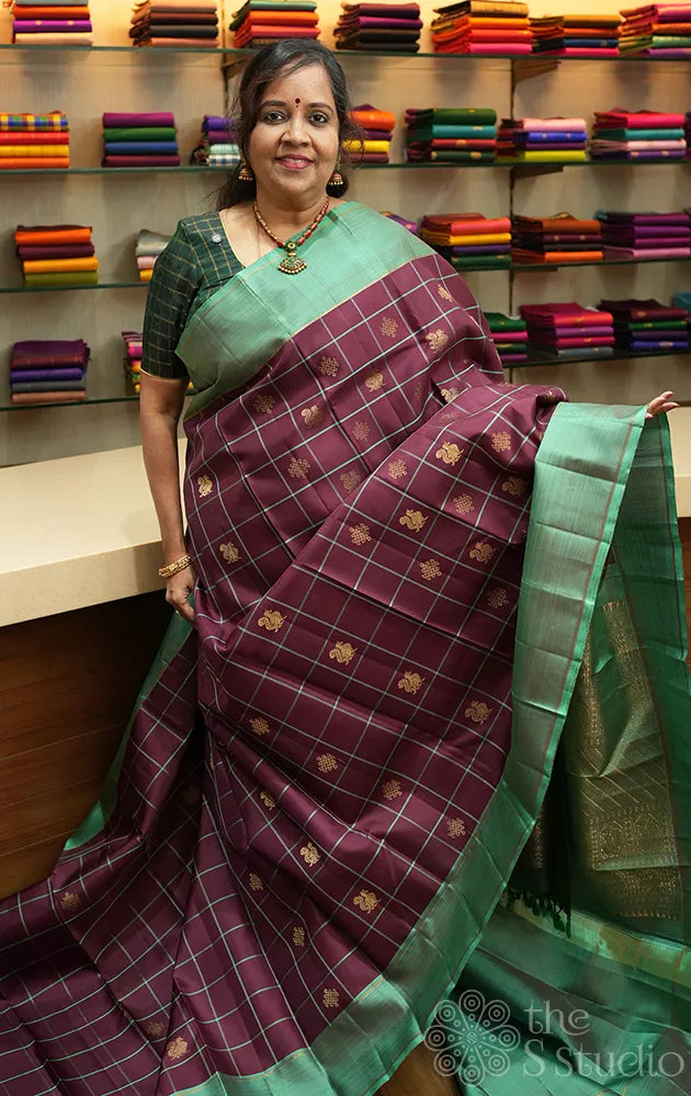 Brown zari checked kanchipuram silk saree with teal green border