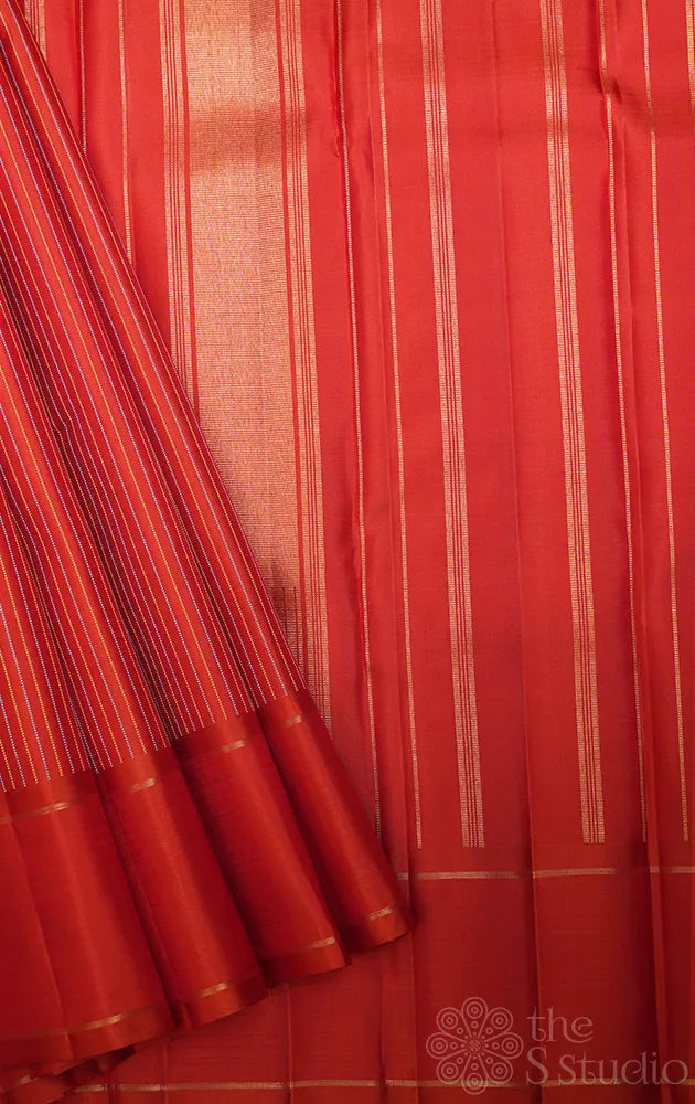 Rust kanjivaram silk saree with thread lines and simple zari border