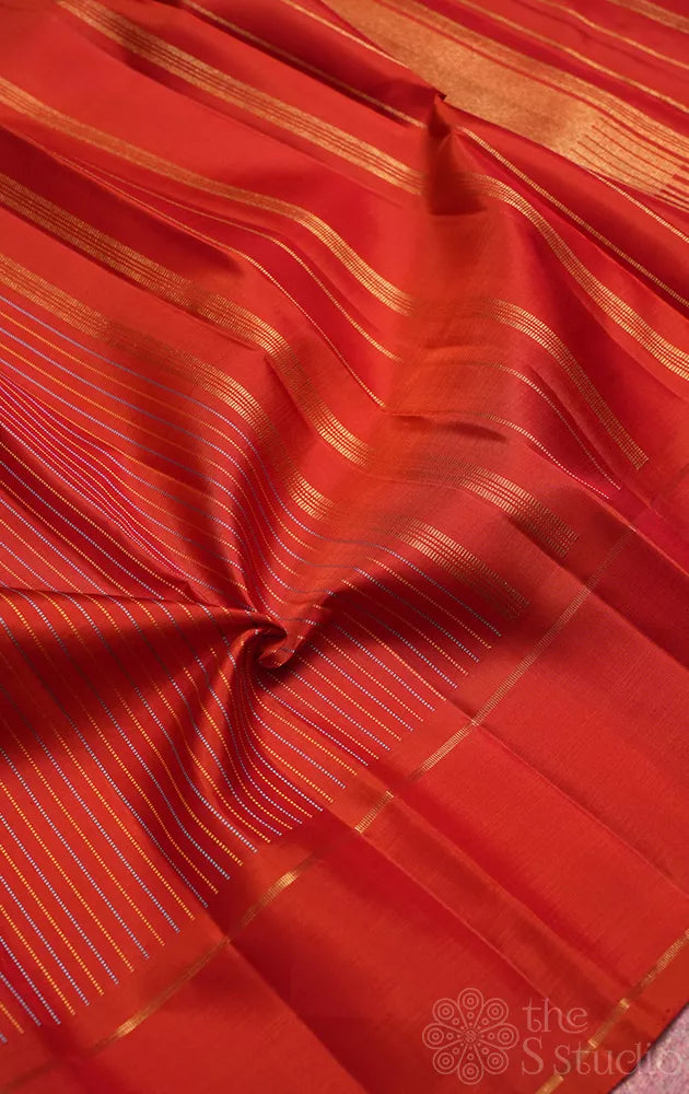 Rust kanjivaram silk saree with thread lines and simple zari border