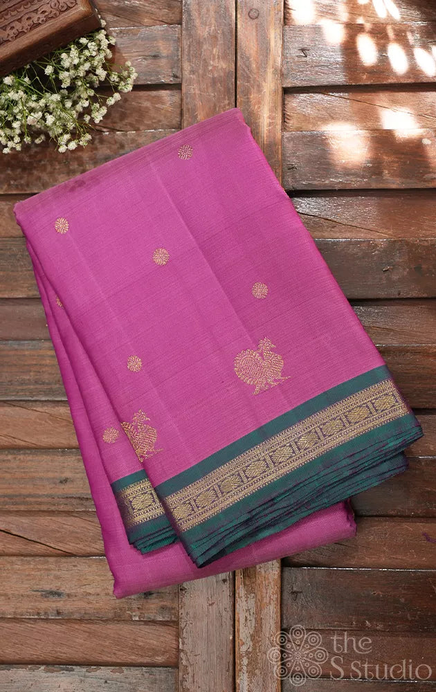 Lotus pink kanjivaram silk saree with small peacock blue border