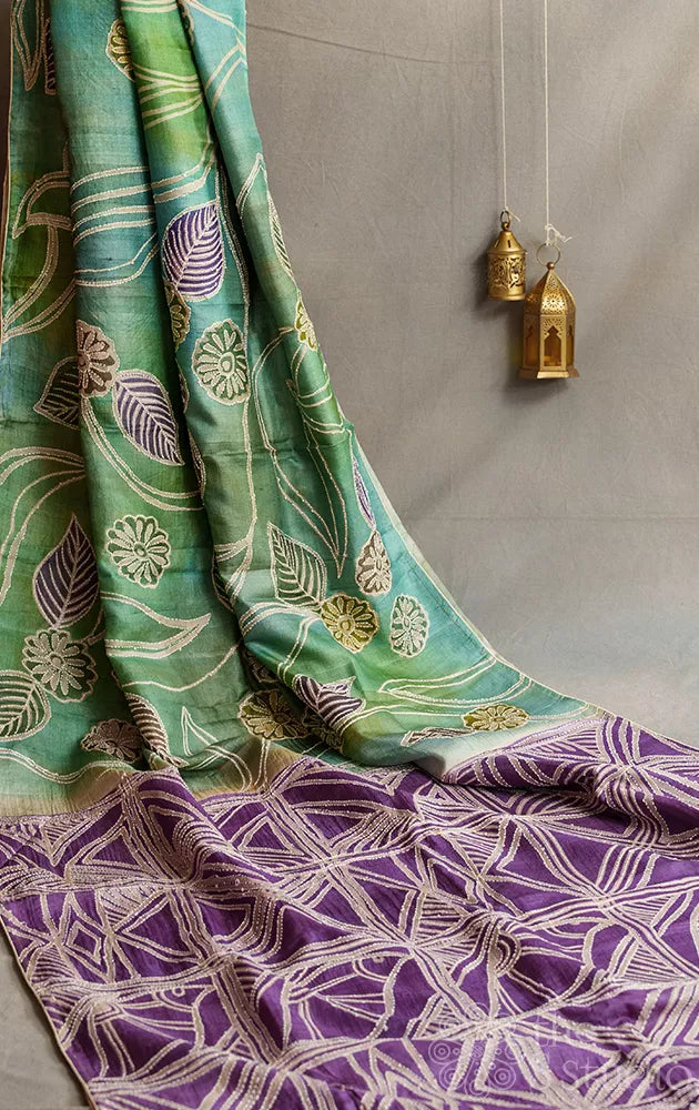 Shades of green and blue tussar silk saree with hand batik print