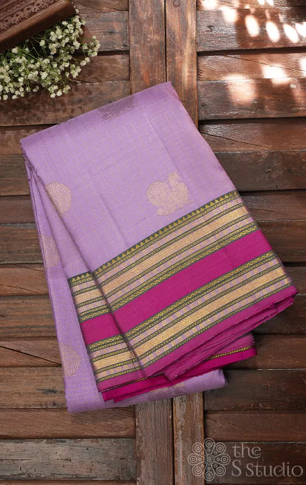 Lavender kanjivaram silk saree with rani pink rettaipet border