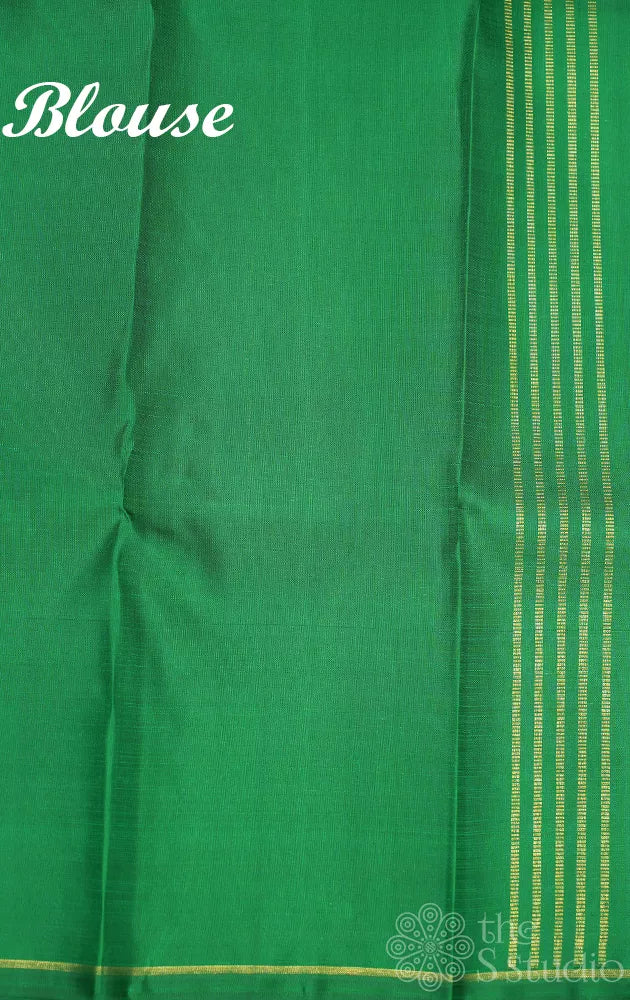 Light pink zari lines kanchipuram silk saree with green pallu