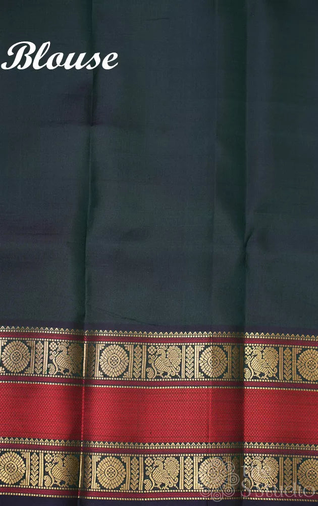 Peacock green kanchi silk saree with rettaipet border and kili motifs pallu