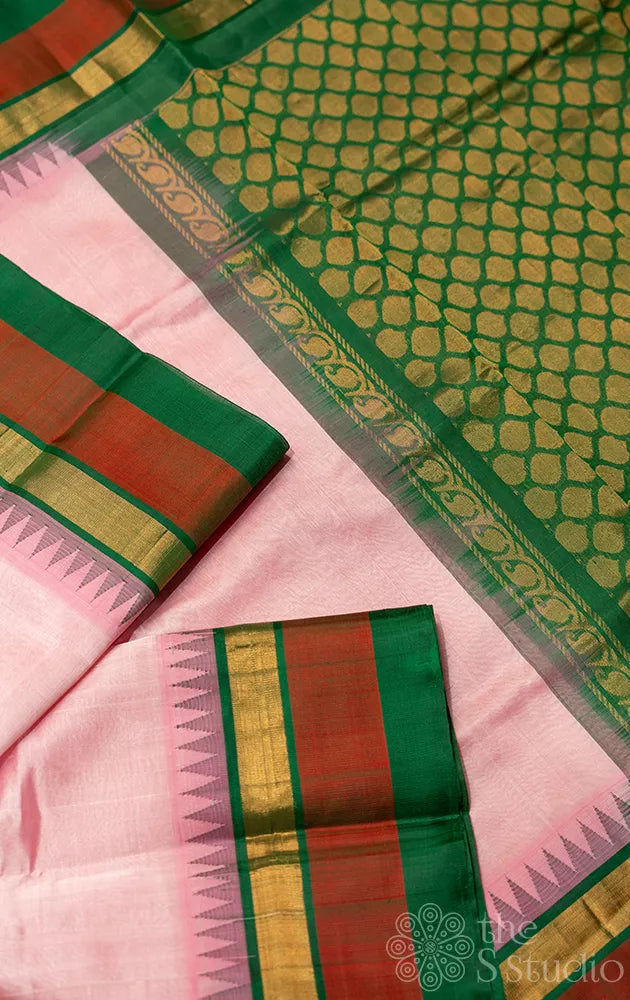 Light pink silk cotton saree with korvai temple border