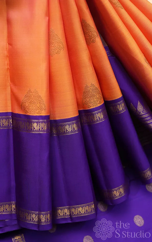 Light orange kanjivaram silk saree with korvai violet border