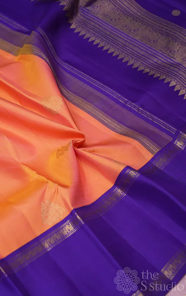 Light orange kanjivaram silk saree with korvai violet border
