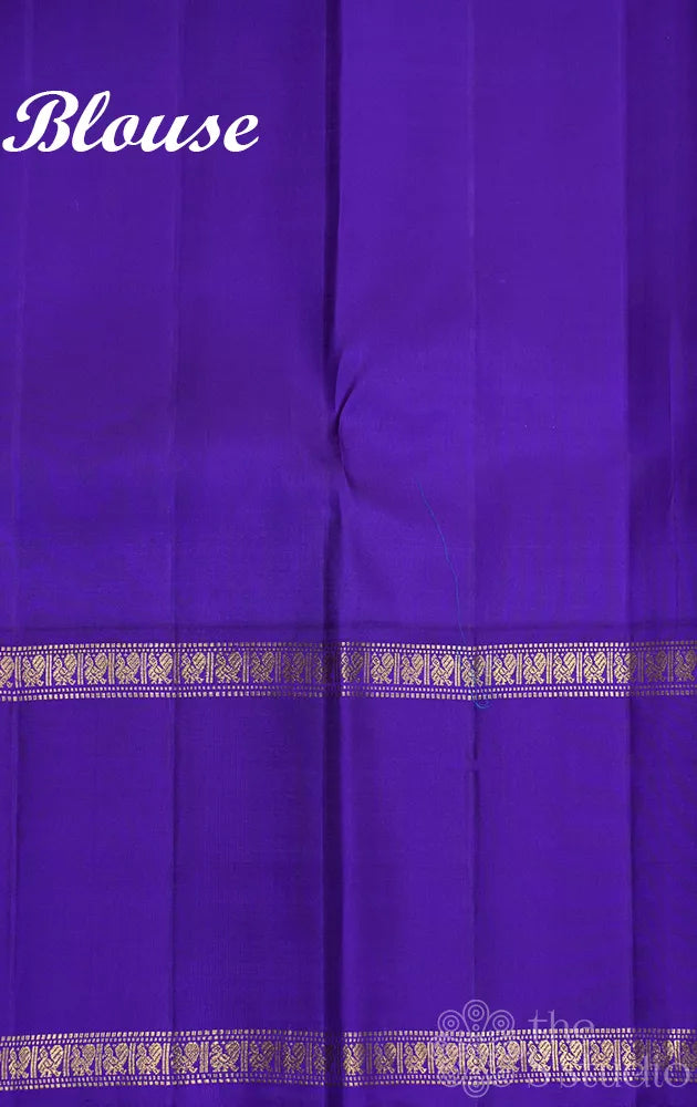 Light orange kanjivaram silk saree with korvai violet border