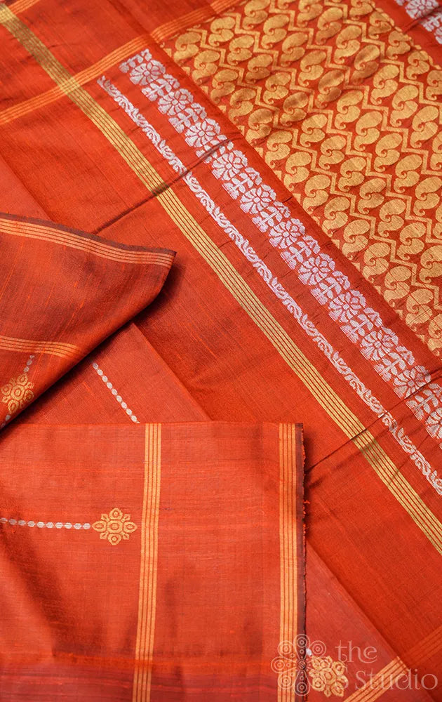 Orange raw silk saree with zari buttas