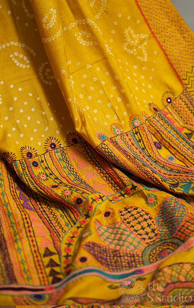 Yellow hand tie & dye bandhani tussar silk saree with lambani embroidery