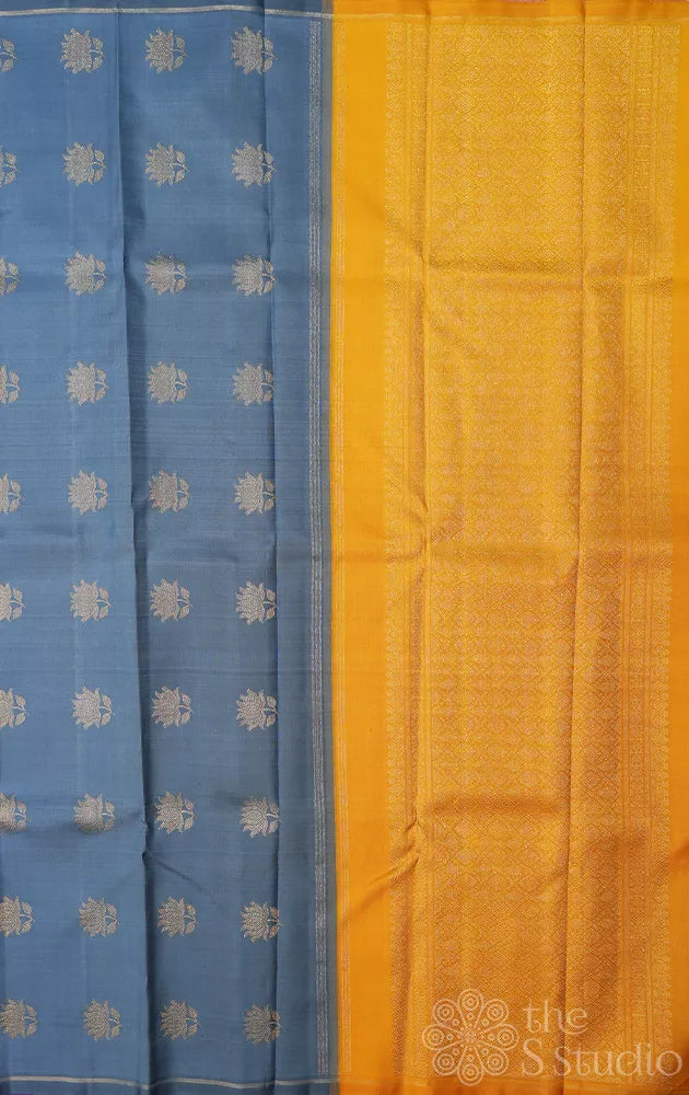 Purple kanchipuram silk saree with kolam buttas and double pallu