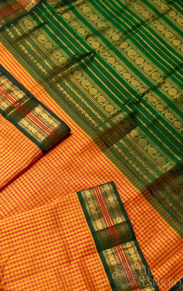 Orange and yellow checked silk cotton saree with korvai border