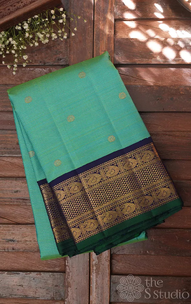 Sea green vairaoosi kanchi silk saree with korvai blue border