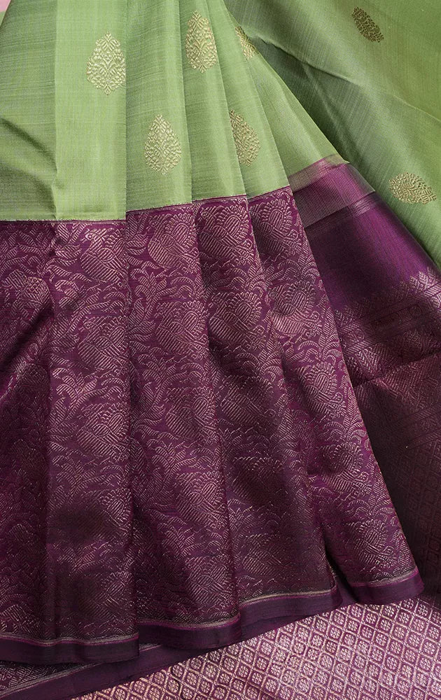 Elachi green kanchi silk saree with korvai purple long border