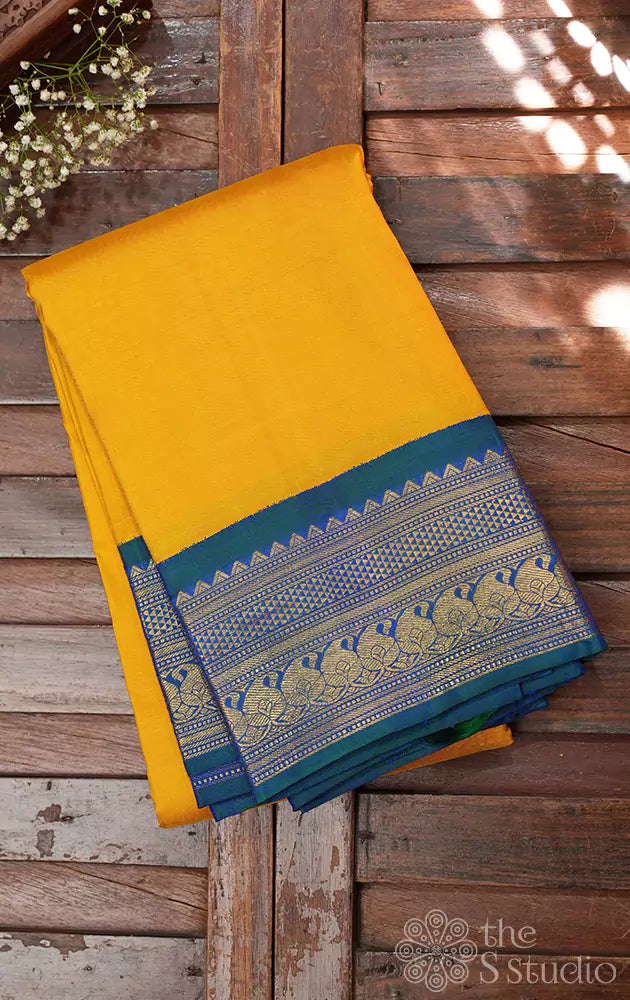 Mustard yellow kanjivaram saree with korvai border