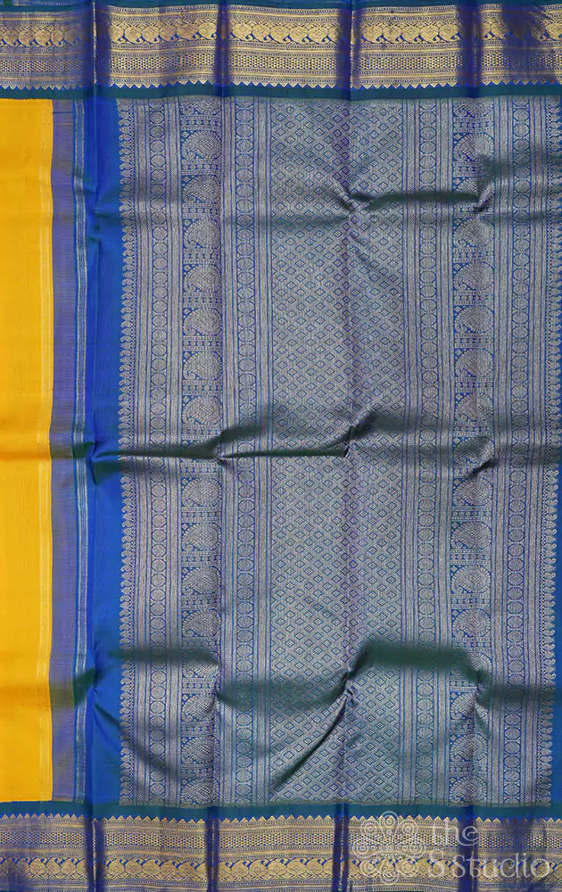 Mustard yellow kanjivaram saree with korvai border