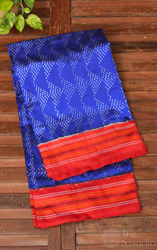 Royal blue twill ikkat silk saree with red border