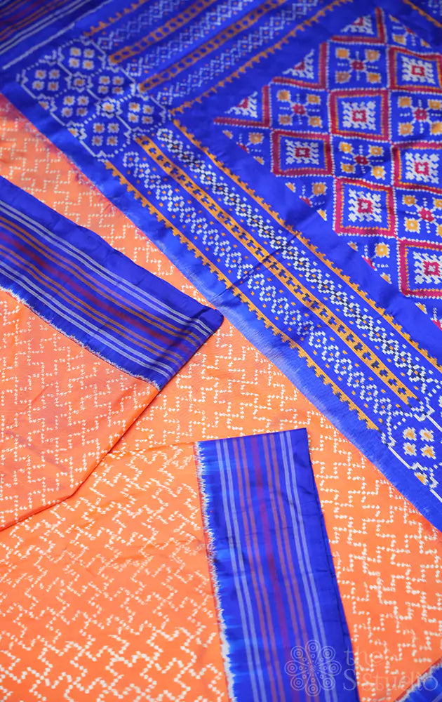 Peach twill ikkat silk saree with blue border