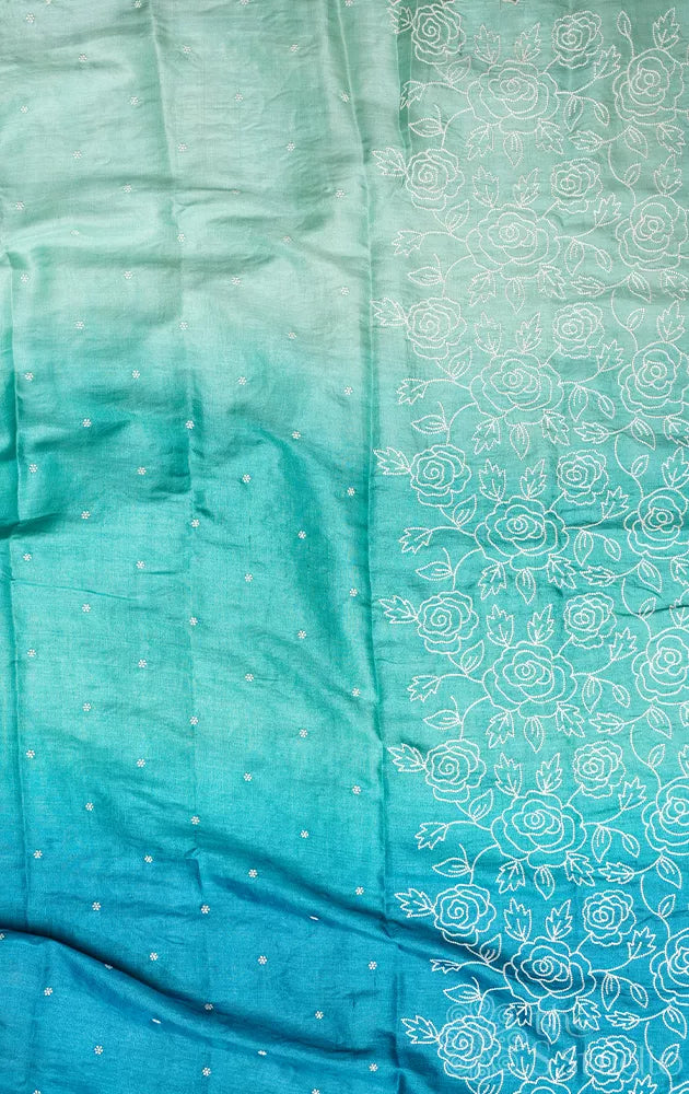 Shades of blue tussar silk saree with white embroidery and scallop border