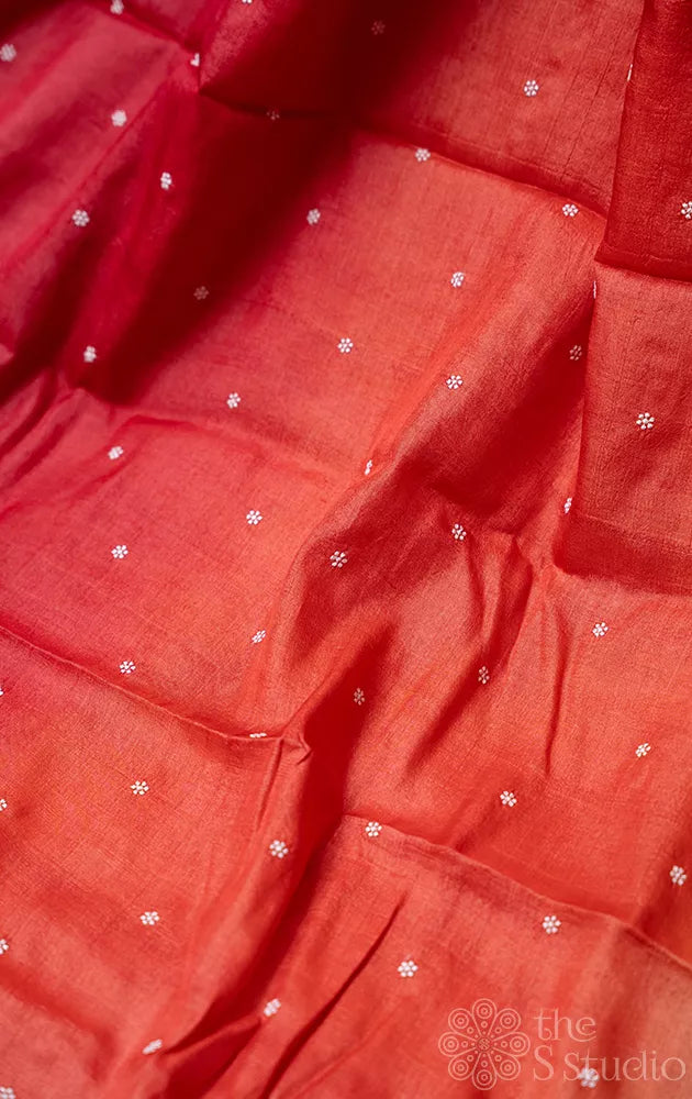 Shades of rust orange tussar silk saree with white embroidery and scallop border