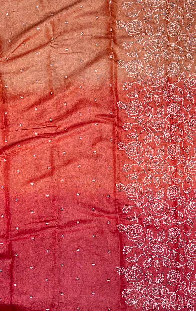 Shades of rust orange tussar silk saree with white embroidery and scallop border