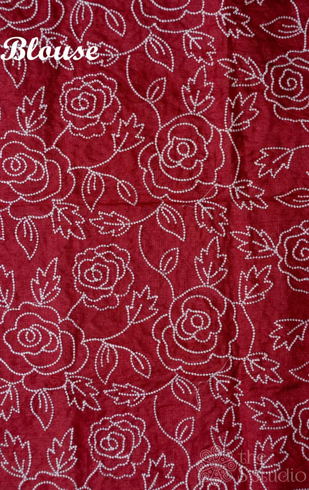 Shades of rust orange tussar silk saree with white embroidery and scallop border