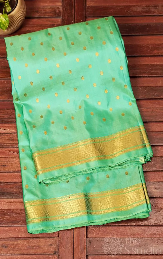 Sea green colour gadwal silk saree with zari buttas