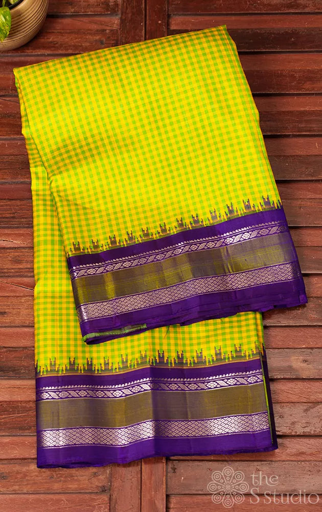 Green and yellow checked gadwal silk saree with navy blue pallu