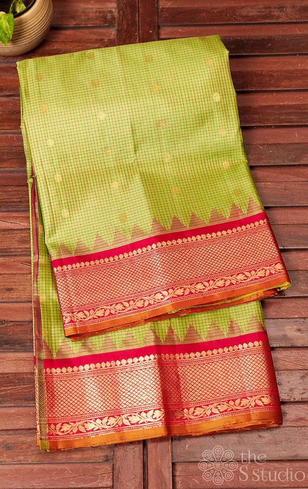 Sage green checked gadwal silk saree with red zari border
