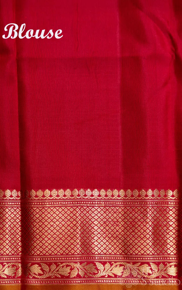 Sage green checked gadwal silk saree with red zari border