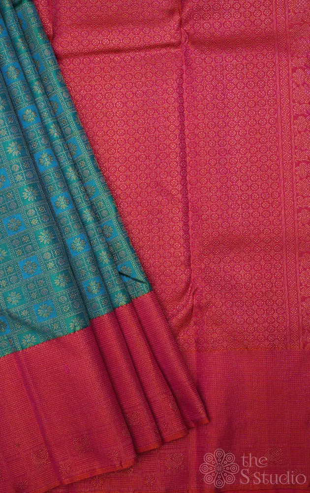 Aqua blue and pastel green kanchi pattu saree with peach big border