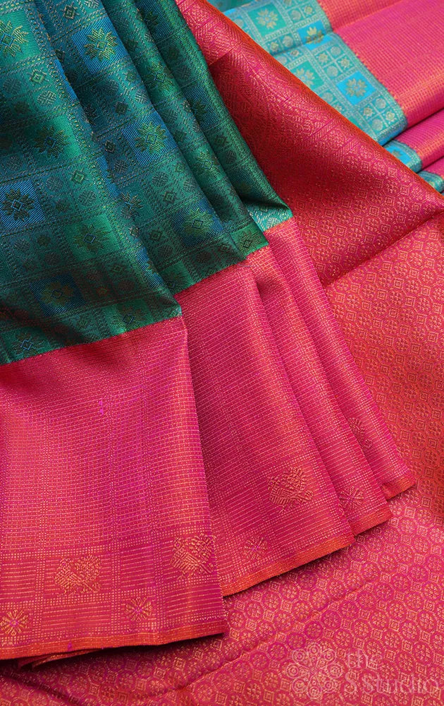Aqua blue and pastel green kanchi pattu saree with peach big border