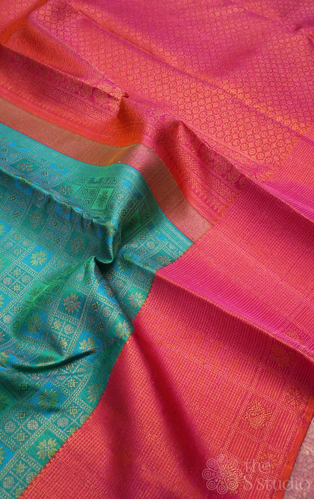 Aqua blue and pastel green kanchi pattu saree with peach big border