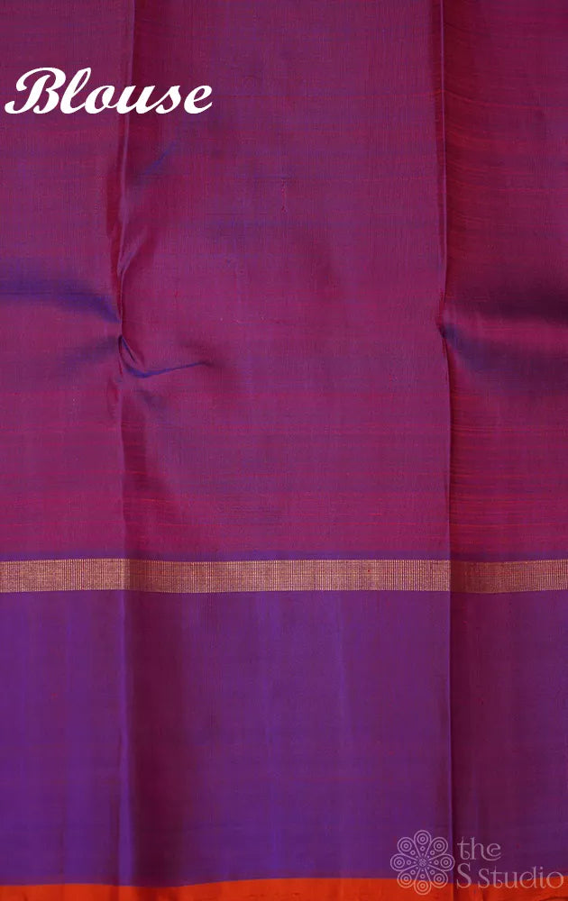 Reddish orange kanchi silk saree with a purple border