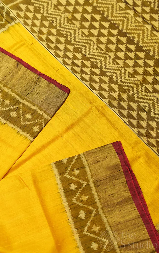 Yellow patola raw silk saree with ikat woven mehandi green border