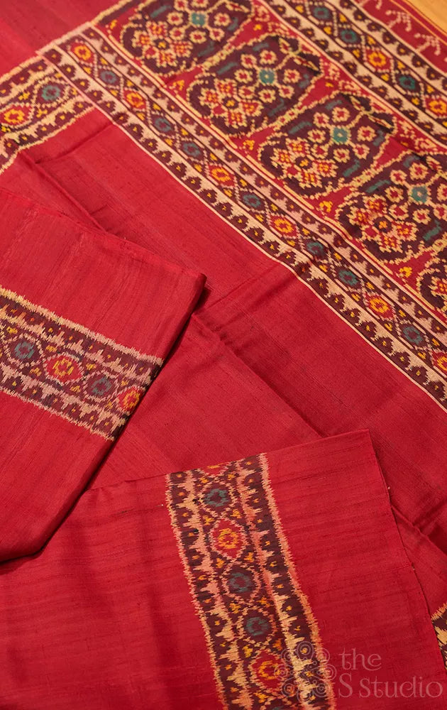 Maroon patola raw silk saree with ikat woven border