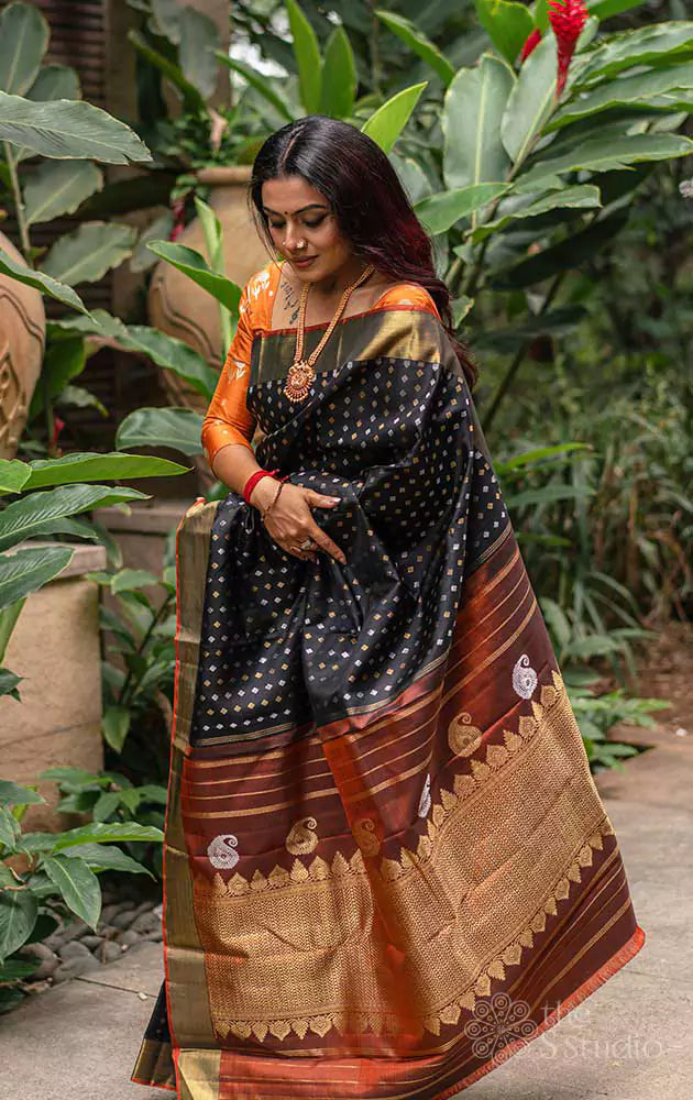 Black Kanchipuram silk saree with silver and gold zari buttas