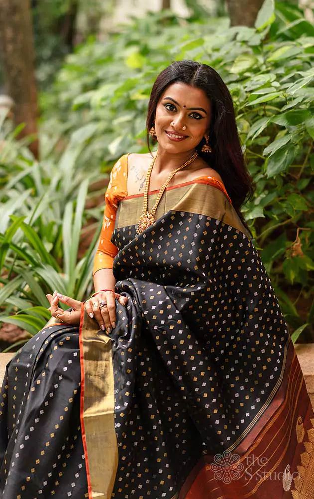 Black Kanchipuram silk saree with silver and gold zari buttas