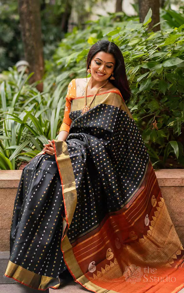 Black Kanchipuram silk saree with silver and gold zari buttas