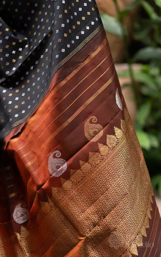 Black Kanchipuram silk saree with silver and gold zari buttas