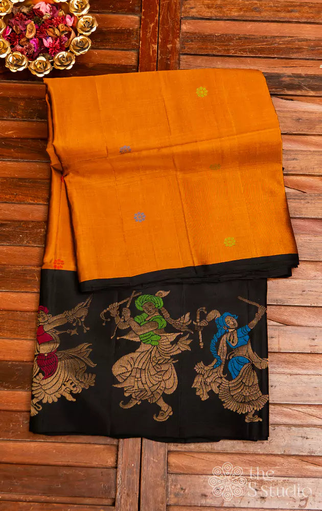 Golden mustard soft silk saree with black border woven with dancers motifs