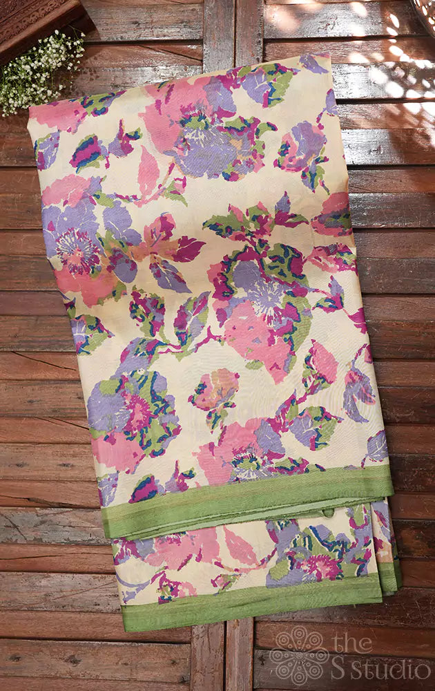 Off white kanchipuram silk saree with pastel prints and elachi green pallu