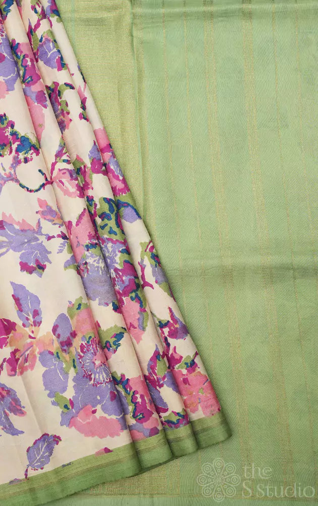 Off white kanchipuram silk saree with pastel prints and elachi green pallu