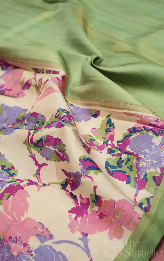 Off white kanchipuram silk saree with pastel prints and elachi green pallu