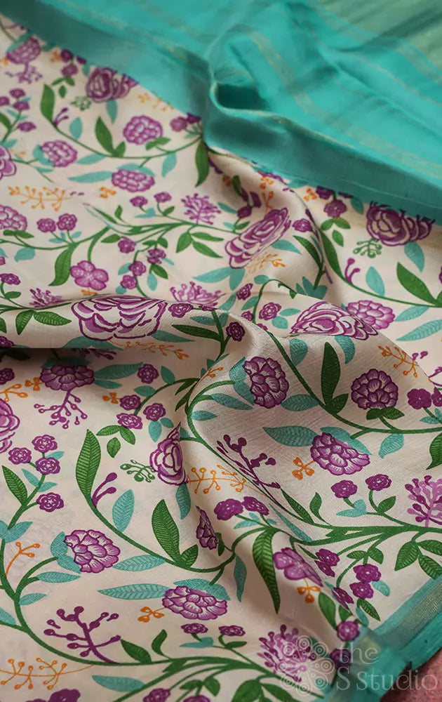 Off white kanchipuram silk saree with small floral prints and sea green pallu