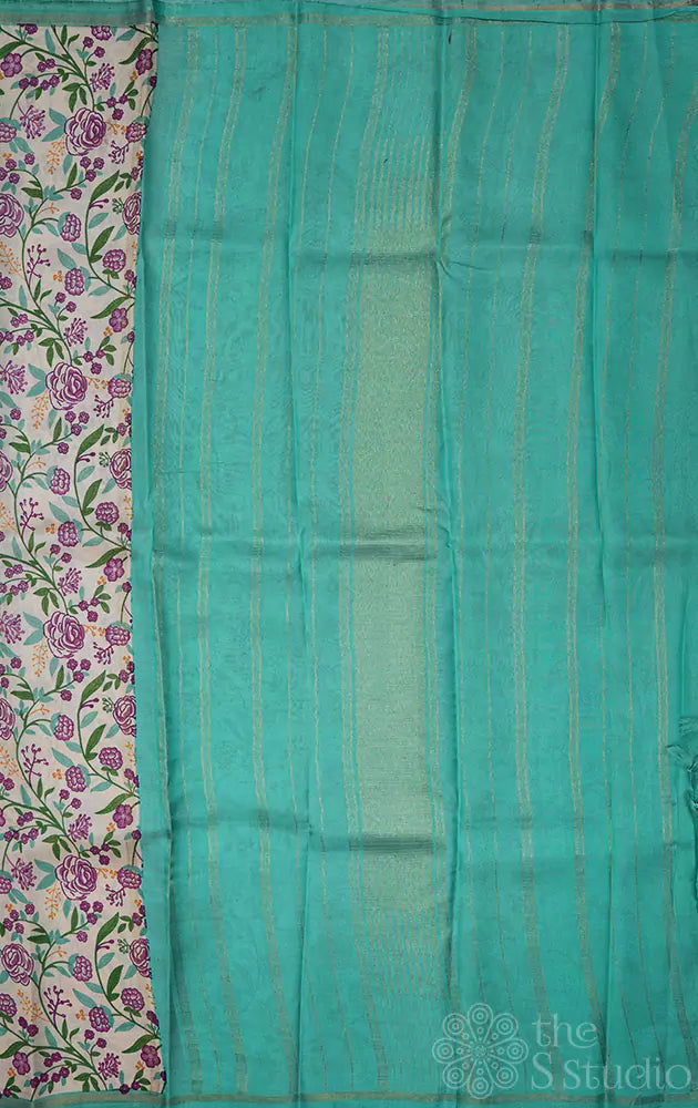 Off white kanchipuram silk saree with small floral prints and sea green pallu