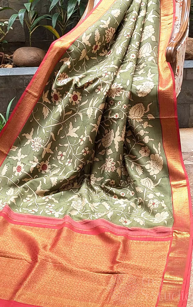 Olive green coloured kanchi hand painted kalamakari saree with korvai red border