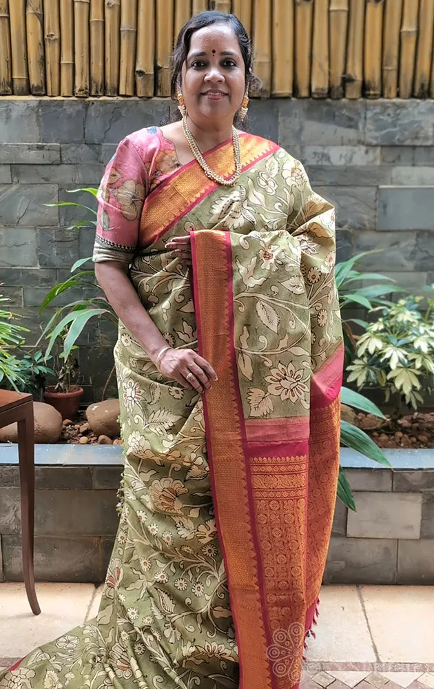 Olive green coloured kanchi hand painted kalamkari saree with korvai red border