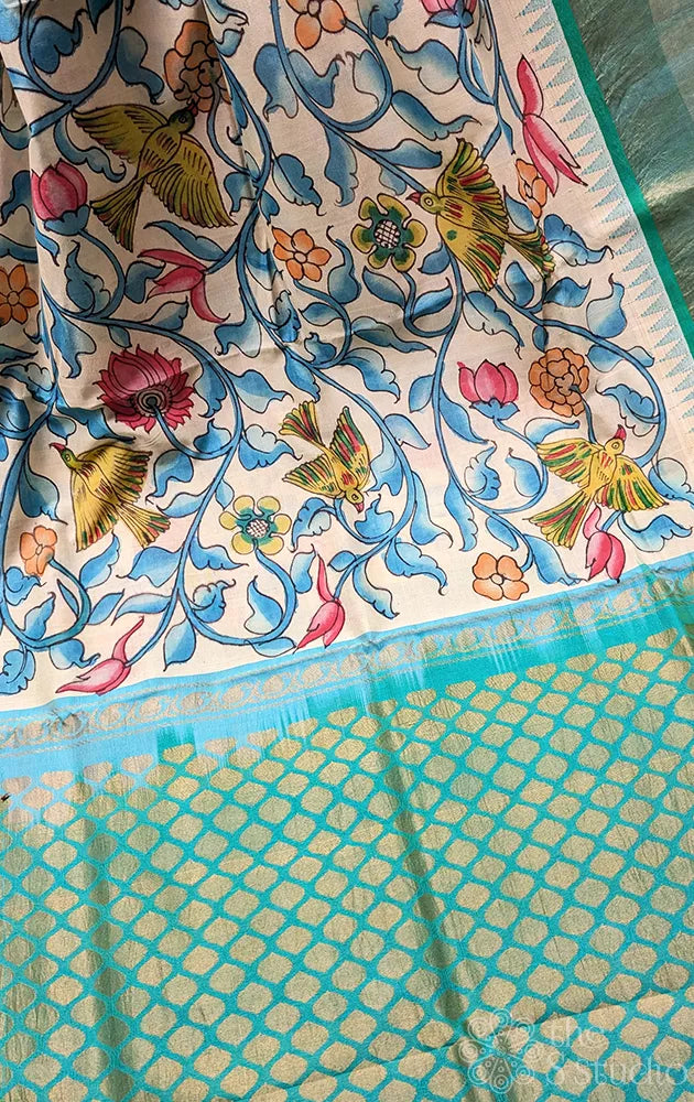 White original handpainted kalamkari saree in silk cotton with blue border